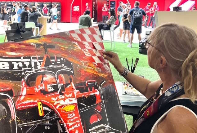 Anita Lewis live painting experience displaying abstract Formula 1 art at the Paddock Club, Miami F1 Grand Prix.