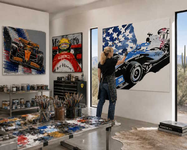 Anita Lewis painting abstract Formula 1 car art in her studio